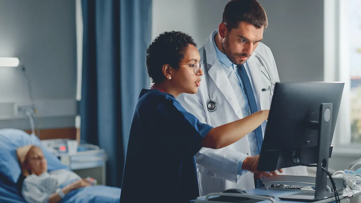 Doctor and nurse looking at a screen in a hospital