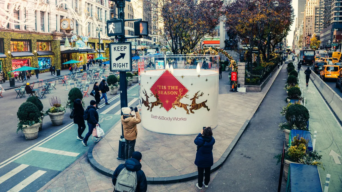 A giant Bath & Body Works candle on the streets of New York City