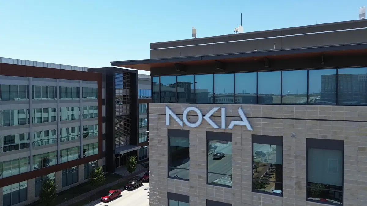 White Nokia logo text on the corner side of a building.