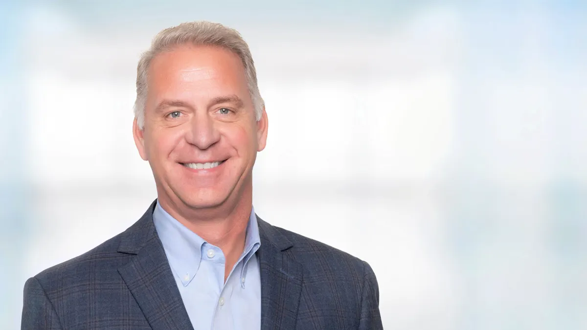 Headshot of Cerner chief client and services officer John Peterzalek