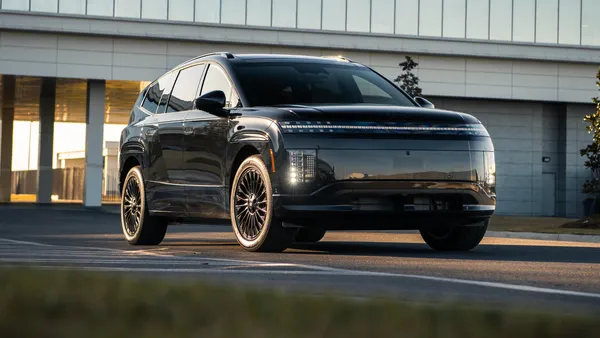 A media photo of a black 2027 Ioniq 9 electric SUV parked outdoors in front of a building.