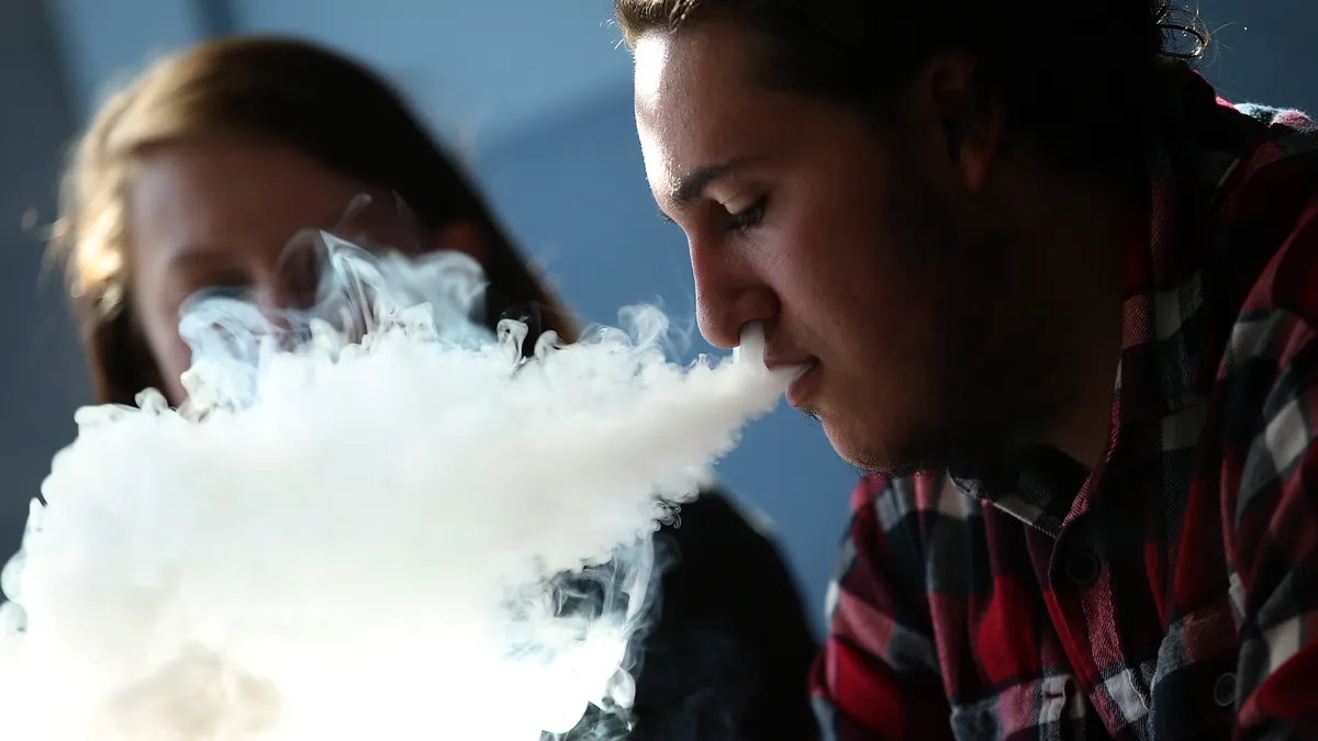 A photo of a person vaping.