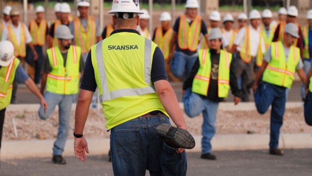 Skanska workers stretch and flex 