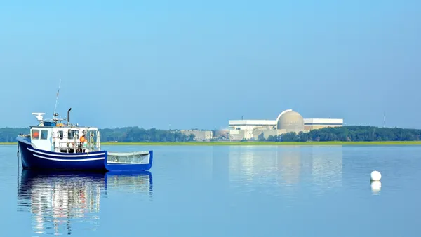 A nuclear power plant sits near the shore.