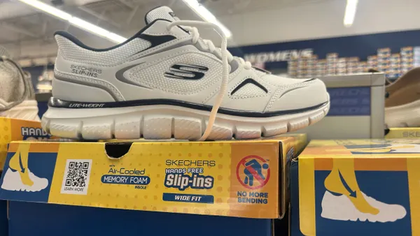 A sneaker is on display for sale.