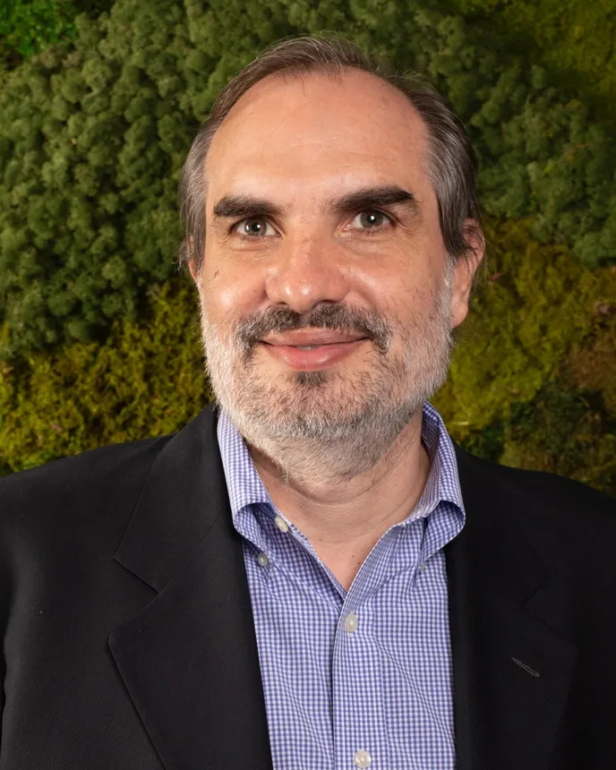 Headshot of a man in a suit.