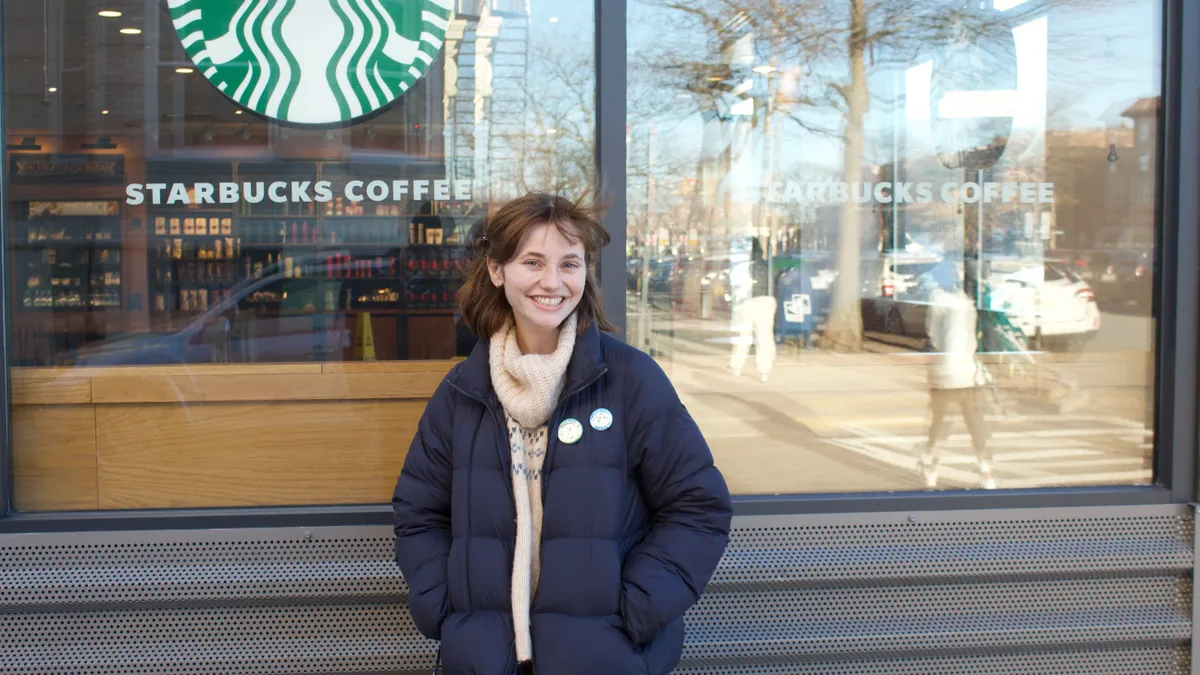 Kylah Clay, Starbucks barista and union organizer, stands outside a Boston Starbucks she helped organize in February 2022.