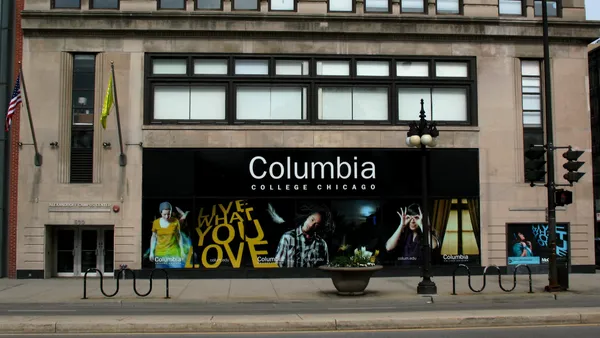 Portrait of a Columbia College Chicago billboard on a building in the city.