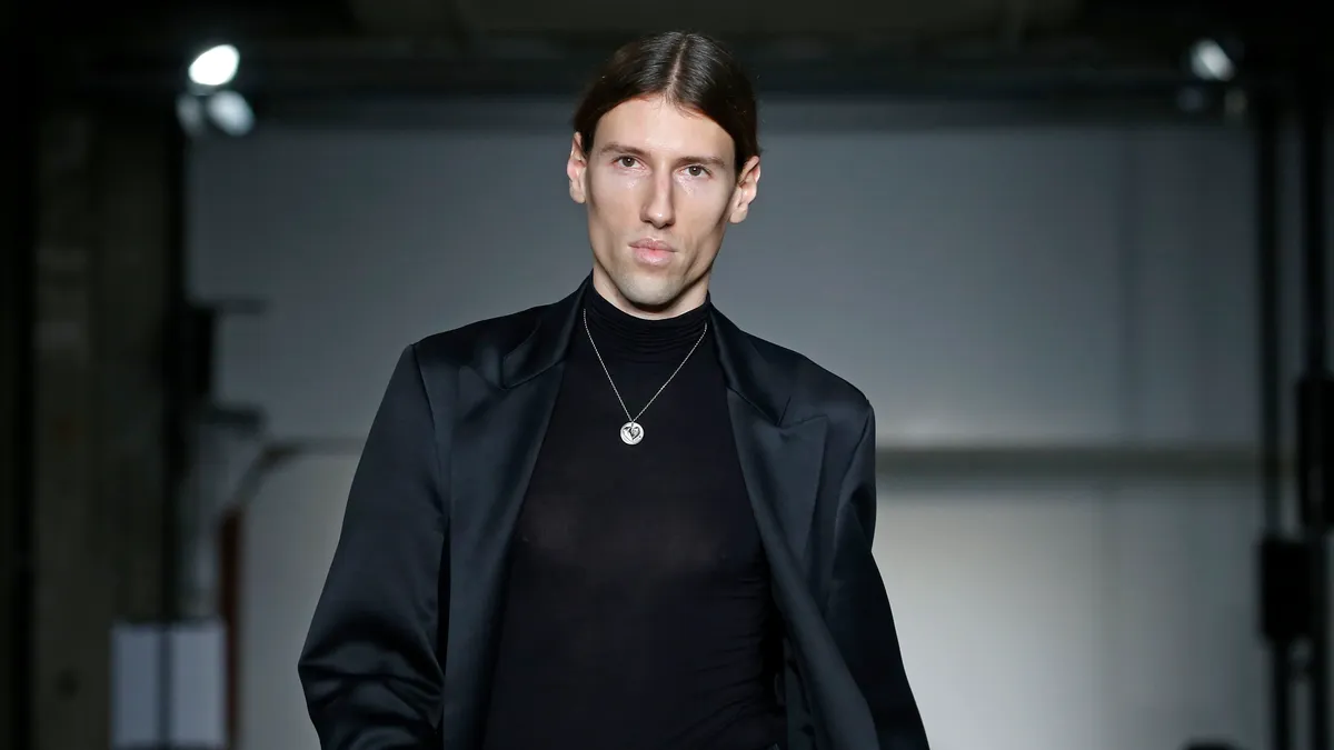 Ludovic de Saint Sernin is pictured on a runway wearing his collection.