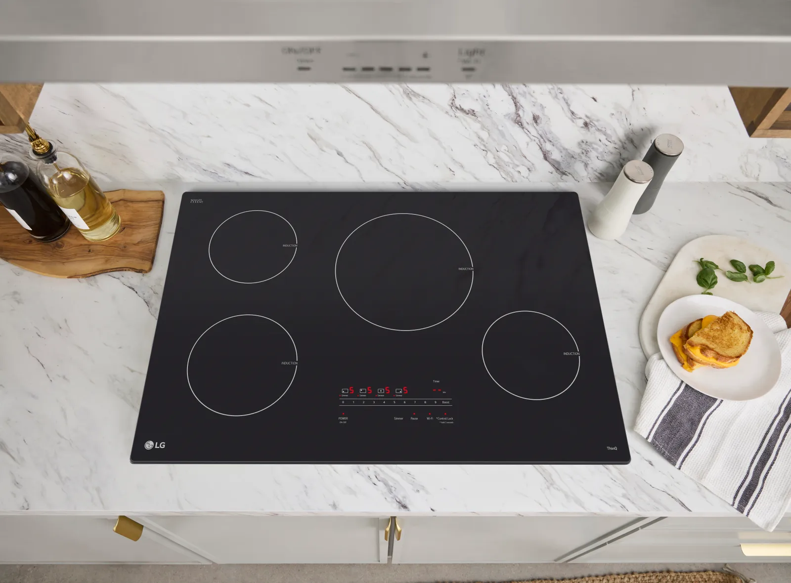 A black cooktop on a white countertop.