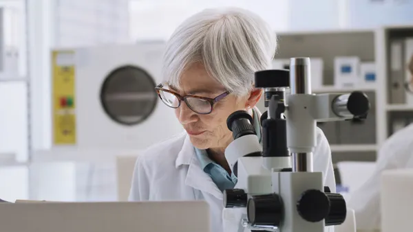 Research scientist testing and experiment with microbiology in a laboratory.