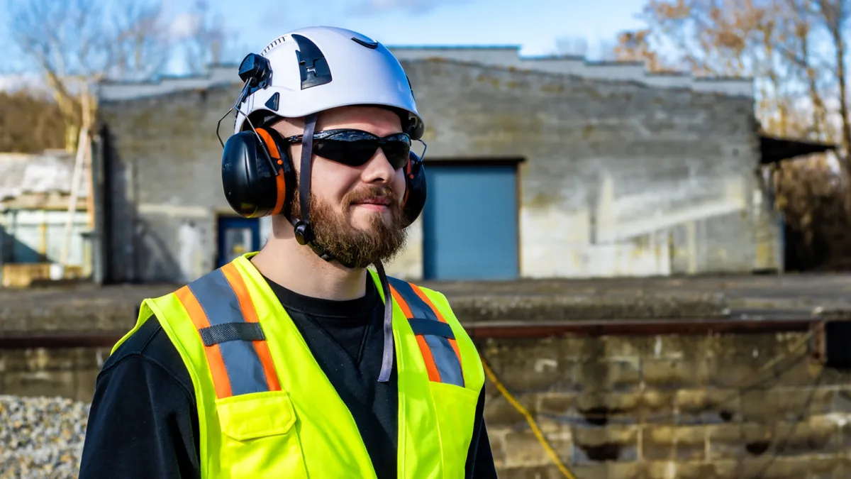 Worker in construction vest and hard hat