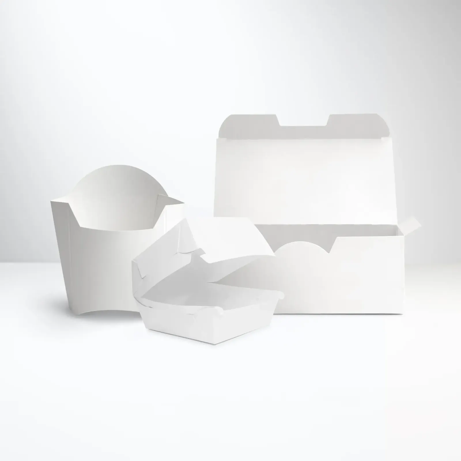 Several white fiber foodservice containers, including a version typically used for french fries.