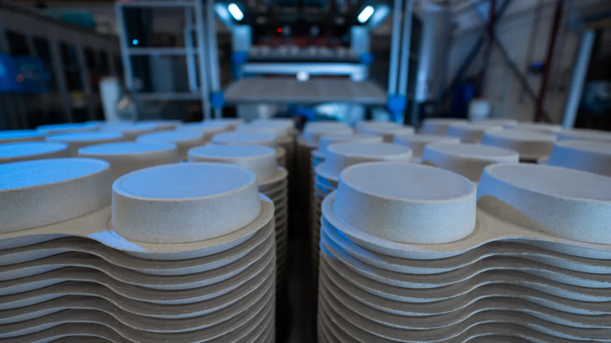 A stack of molded fiber containers.