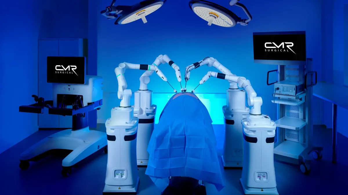 CMR Surgical's Versius Plus robotic system is shown in blue lighting.