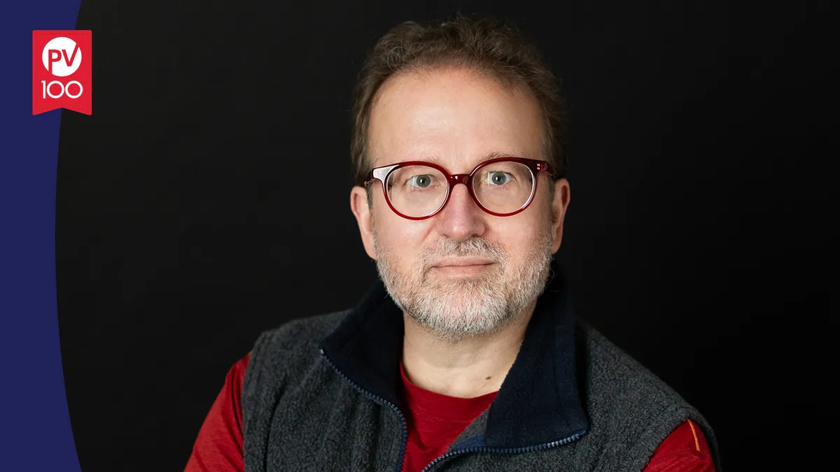 A portrait of David Katz framed with a banner icon that reads "PV 100"