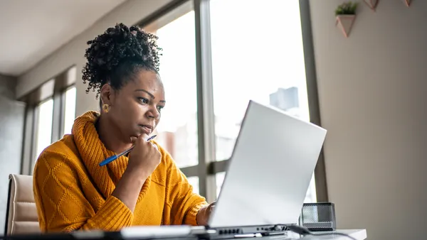 POC woman working from home office