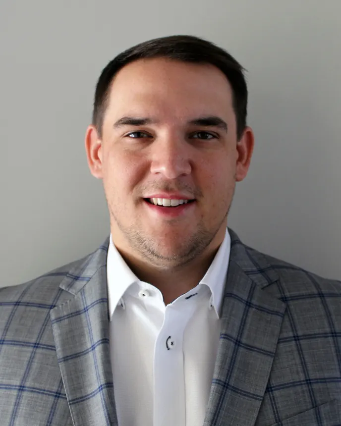 A headshot of Ryan Wilson