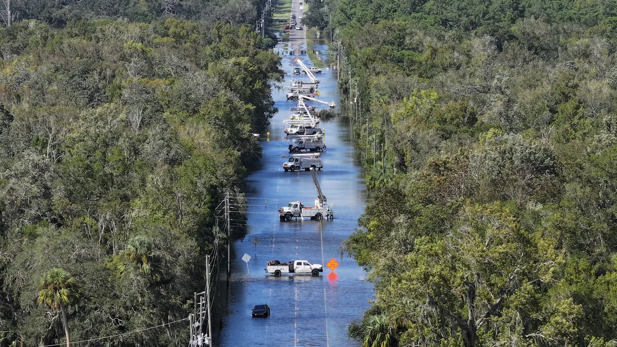 Power crews work on the lines after Hurricane Helene