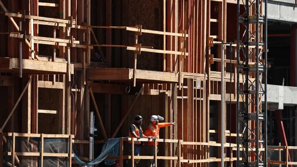 Construction continues on a mixed-use apartment complex