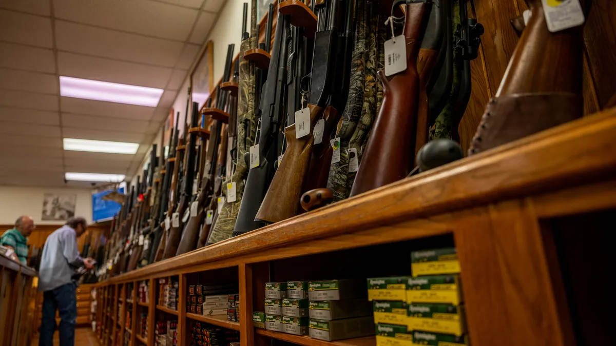 Rifles are shown in a gun store