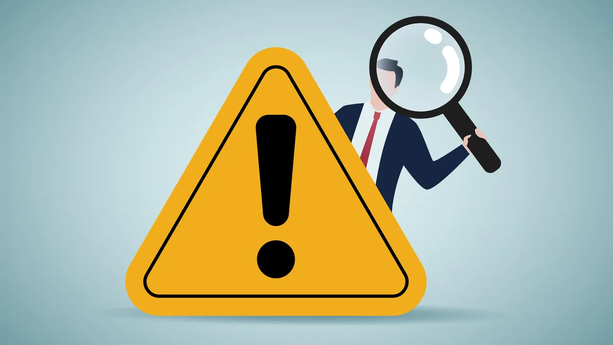 an illustration of an executive holding a large magnifying glass standing behind a triangular yellow traffic sign with an exclamation point on it