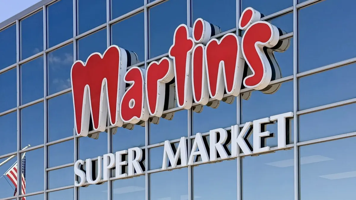 Sign with "Martin's" in red letters above "Super Market" in white letters on a blue background.
