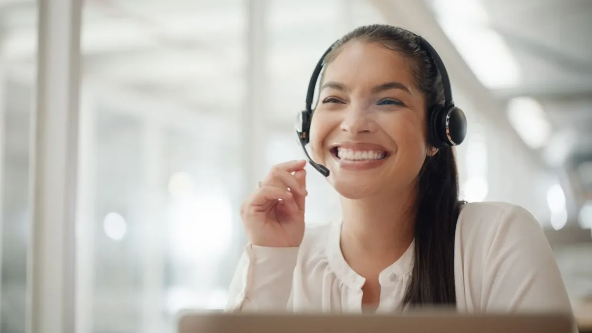 Customer call rep smiling on the phone