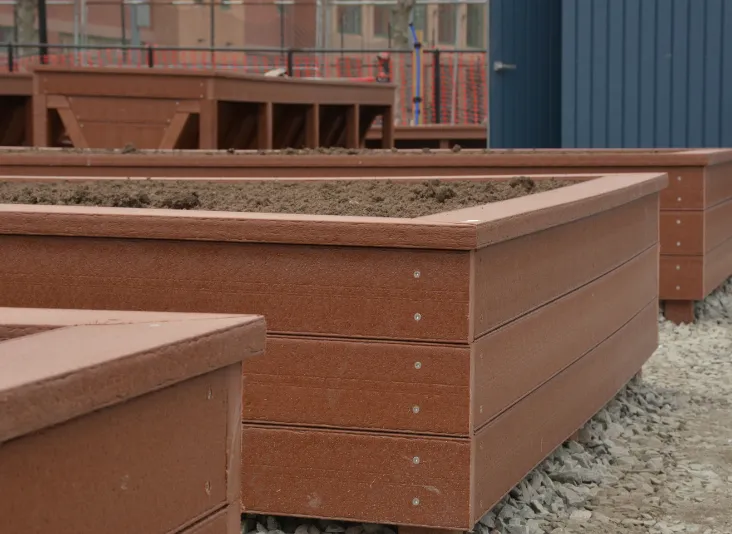 Close up of community garden beds made from plastic lumber in Somerville, Mass.