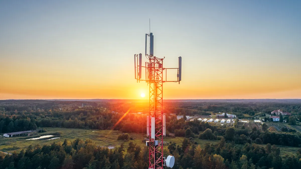 Cellphone antenna with sunset background.