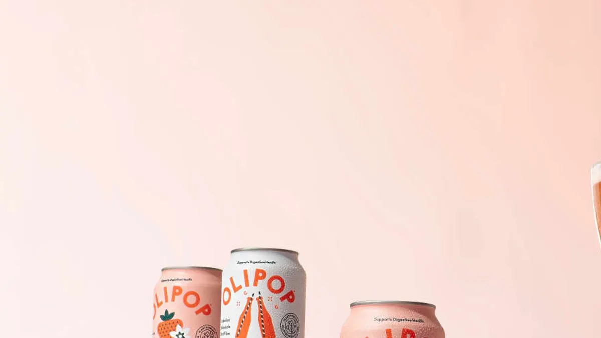 Cans of Olipop soda.