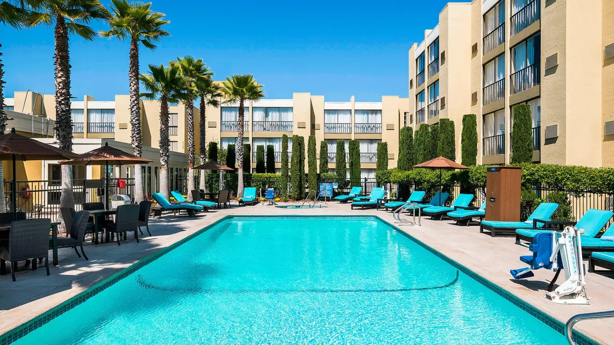 The outdoor pool at Four Points San Rafael, surrounded by lounge chairs.