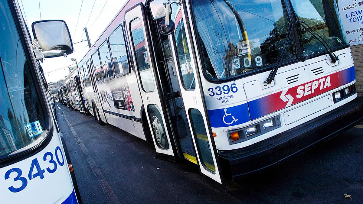 Empty Southeastern Pennsylvania Transportation Authority (SEPTA) buses are parked at a large facility.