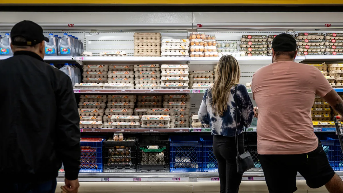 Customers shop for eggs at a H-E-B grocery store on February 08, 2023, in Austin, Texas.