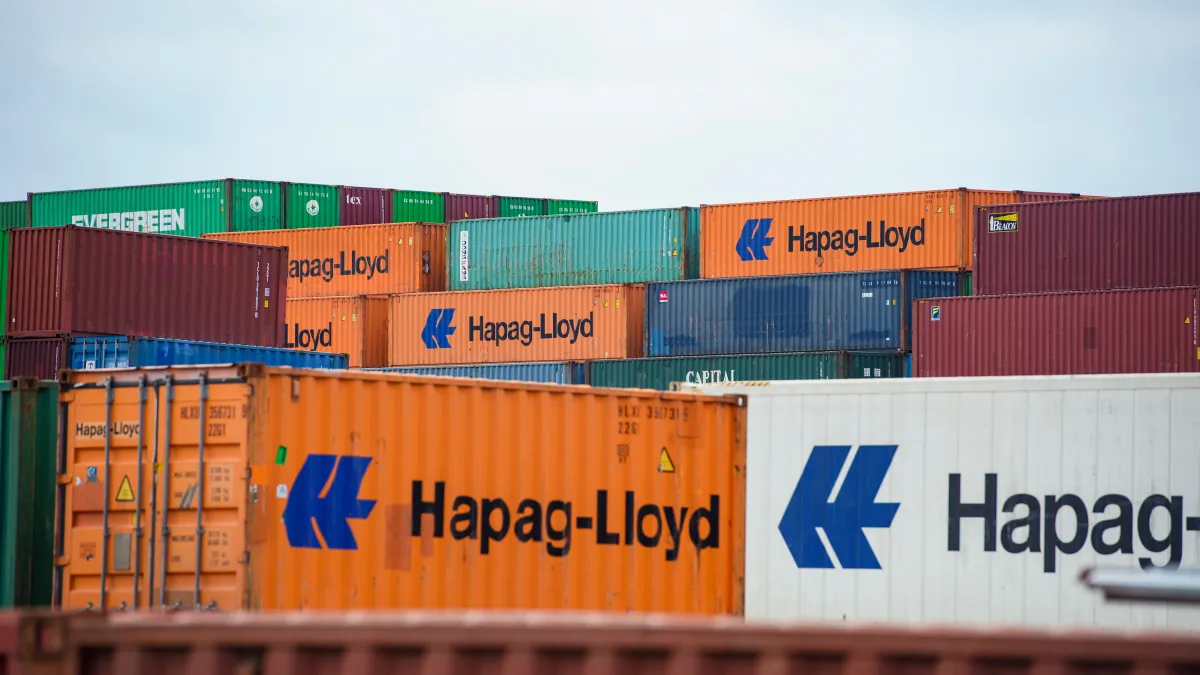 Shipping containers stand stacked at Hamburg Port on October 5, 2022.