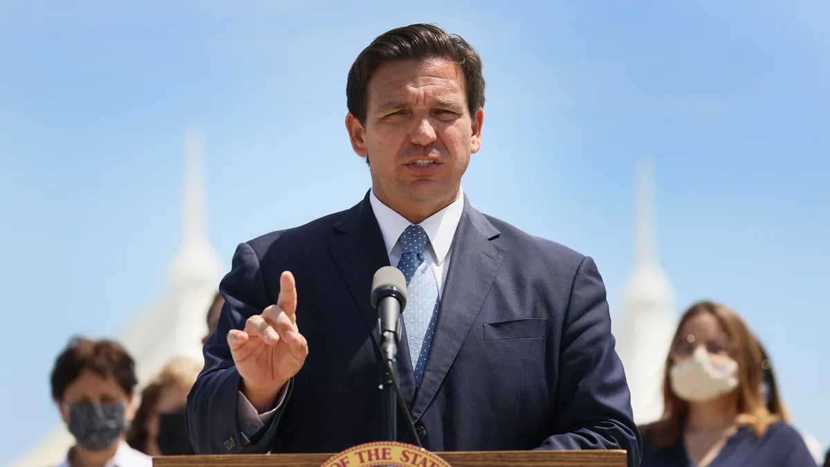 Florida Governor Ron DeSantis speaks at a podium.