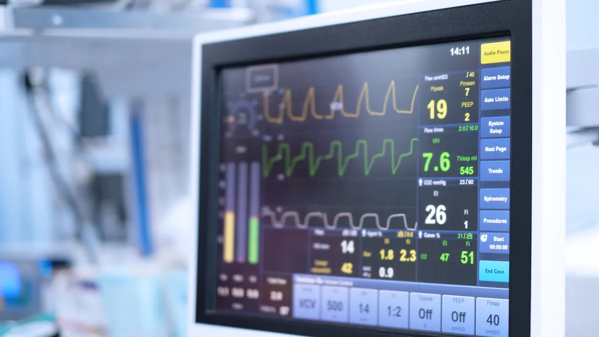 Close up of a monitor showing three different lines with health metrics