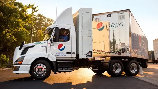 A PepsiCo driver in a PepsiCo truck.