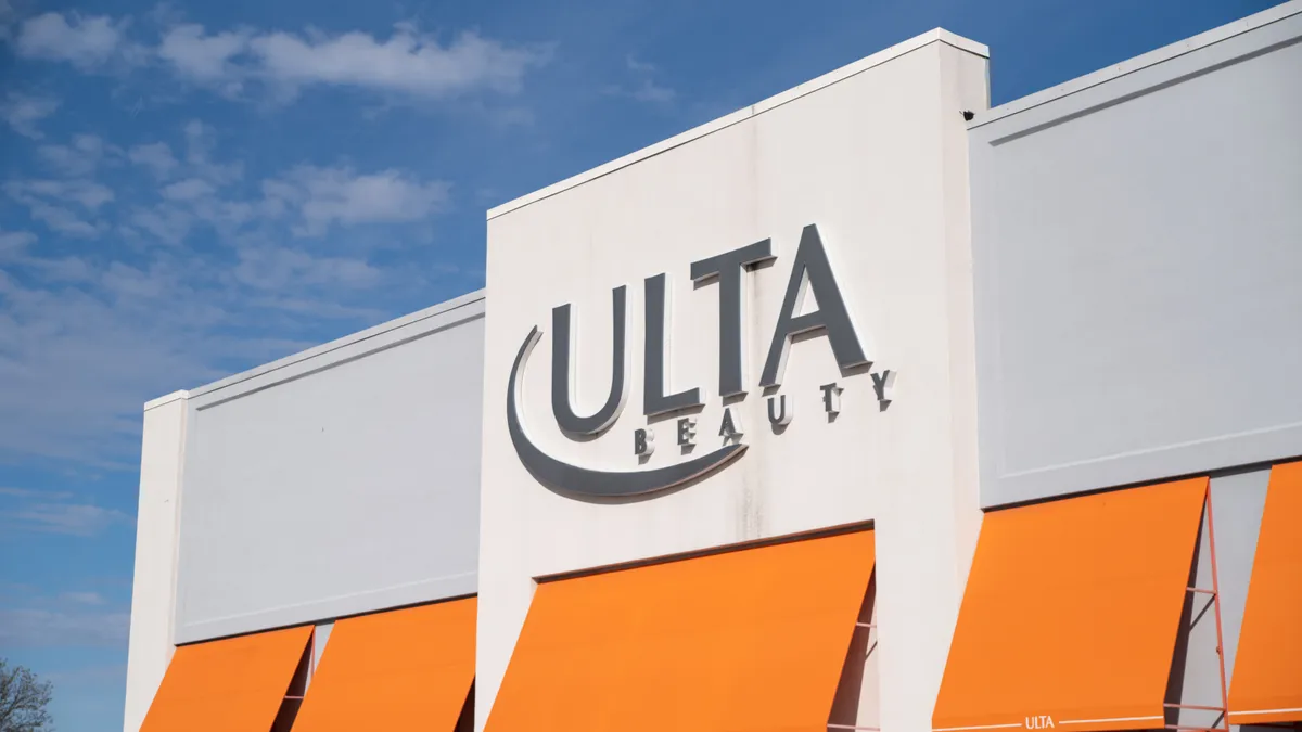 Orange and white exterior of an Ulta Beauty store.