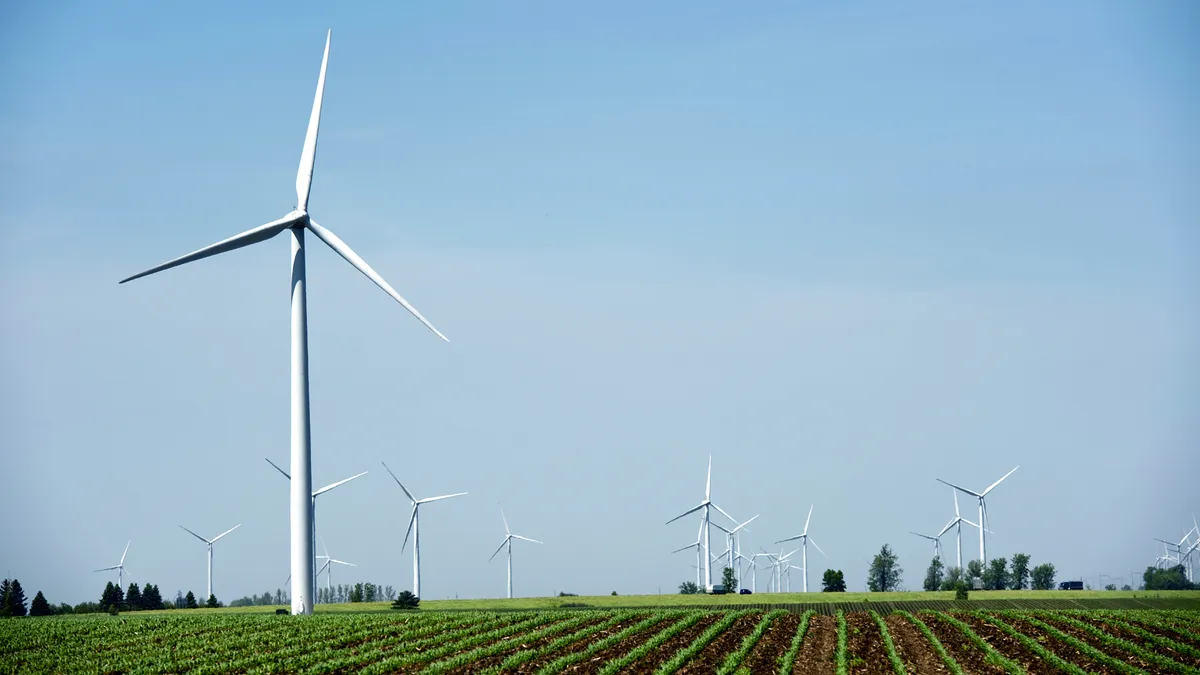 Wind turbines on a corn field