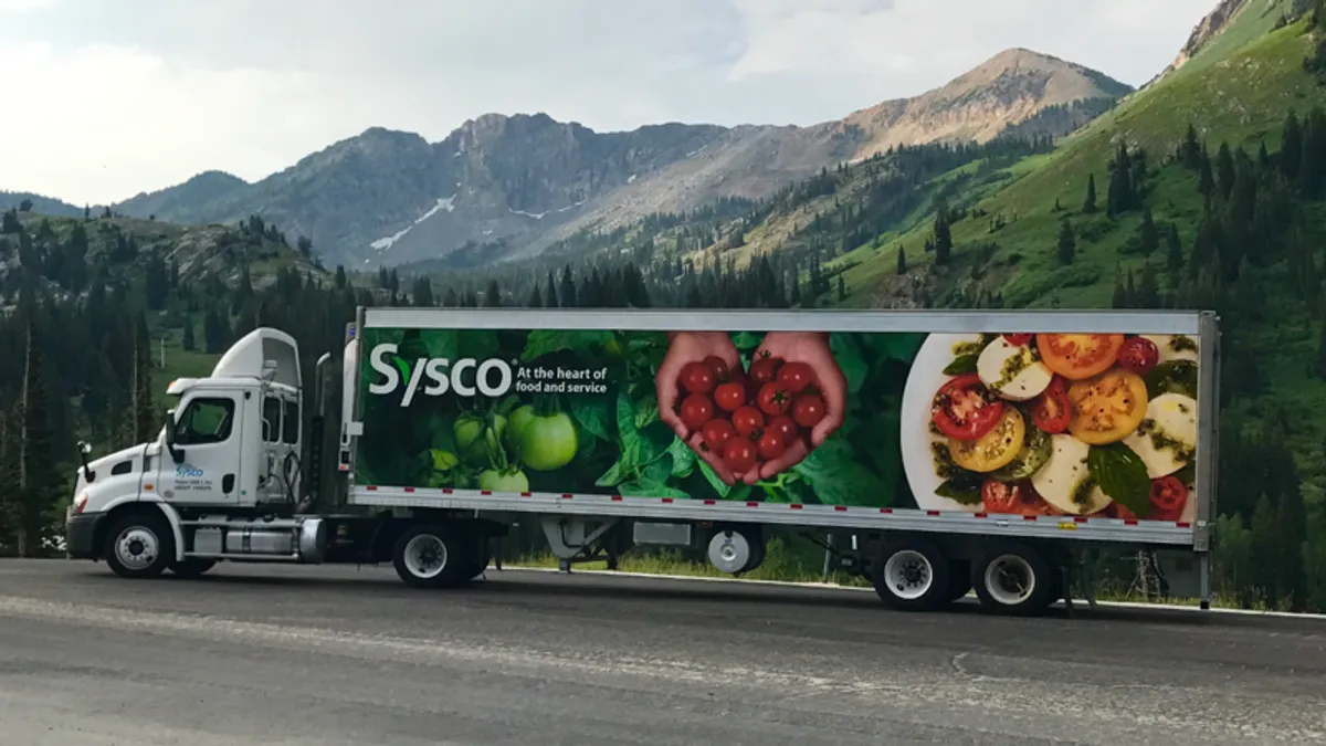 A Sysco truck outside.