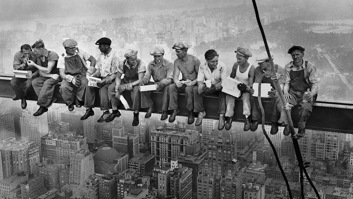 Eleven construction workers eat lunch hundreds of feet in the air.