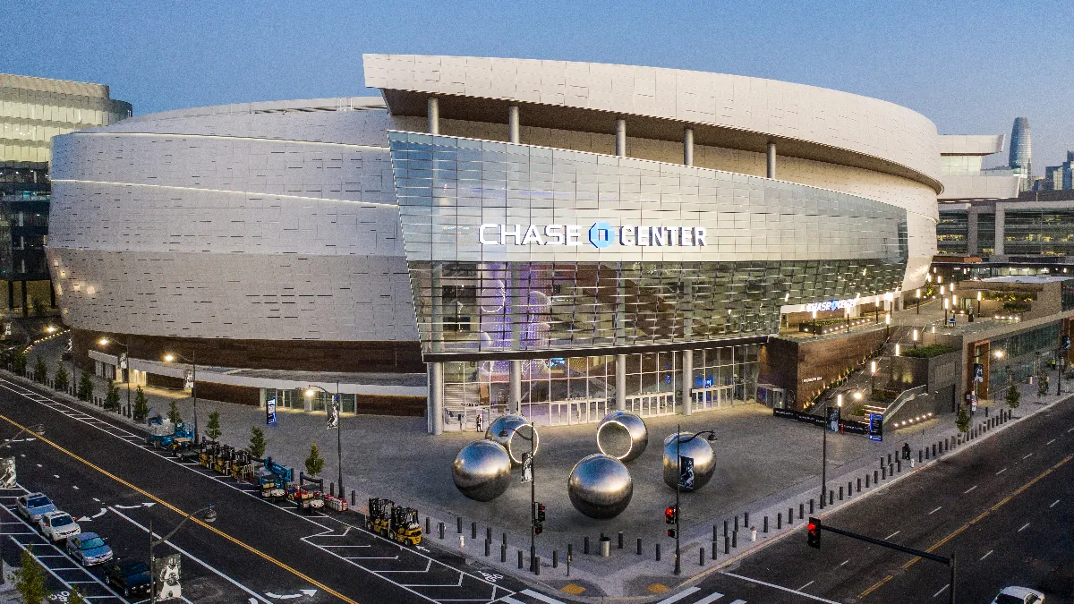 An image of a gray stadium with Chase Center on the side.