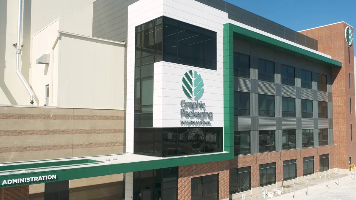A commercial building's exterior features Graphic Packaging International's name and logo.