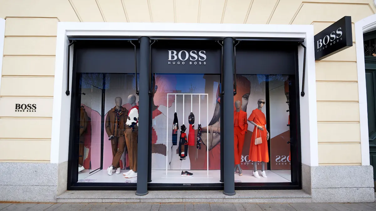 A Hugo Boss clothing store as seen from the outside on a sunny day.