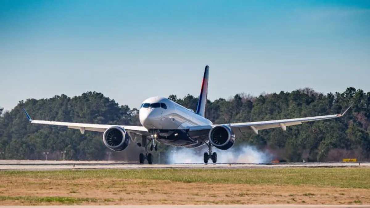 Delta Air Lines plane taking off from airport runway