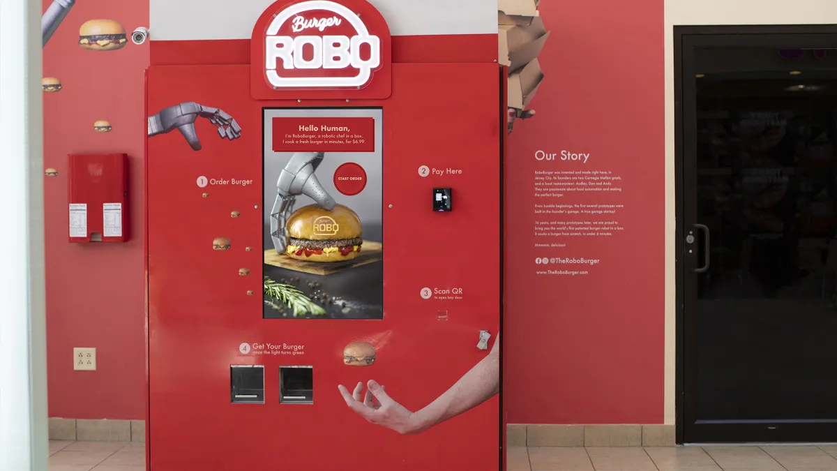 An image of a red vending machine that serves burgers.