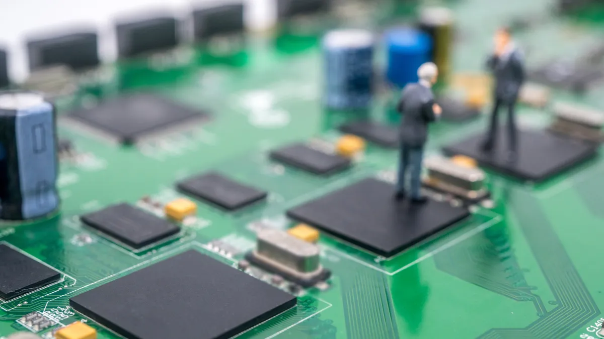 Miniature people on the circuit board