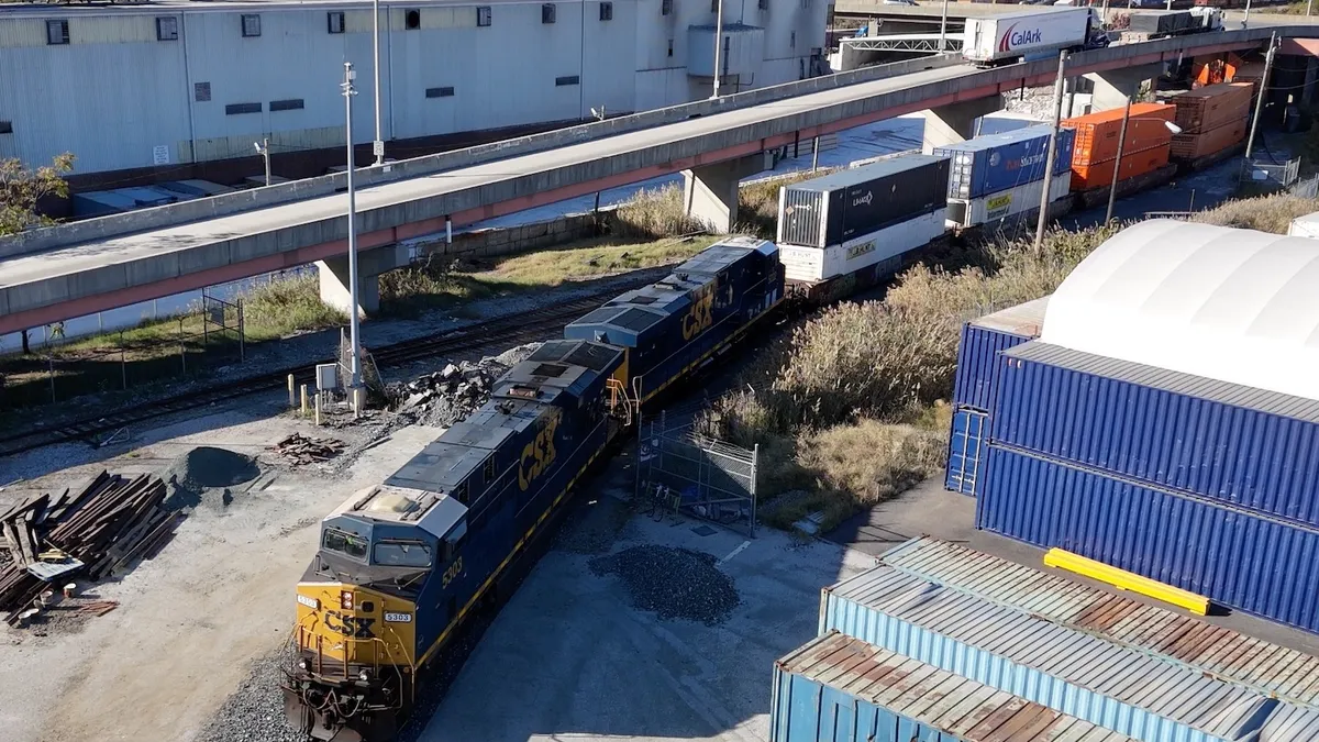 A CSX locomotive pulls the first double-stacked container train from the Port of Baltimore on Oct. 28.