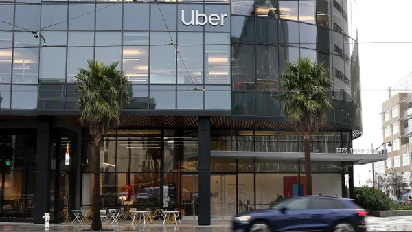 A car drives by Uber headquarters on February 07, 2024 in San Francisco, California.